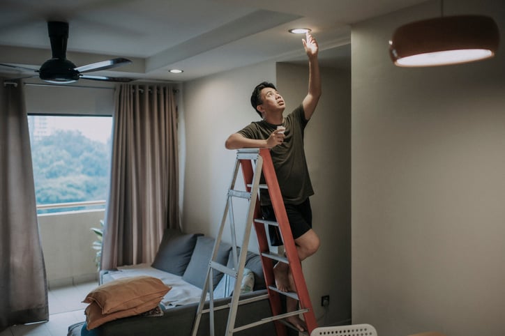 Man making repairs on a home